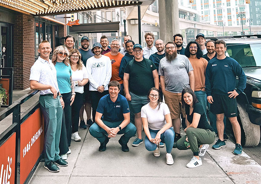 Image of the Rivet team gathered on a sidewalk in Detroit